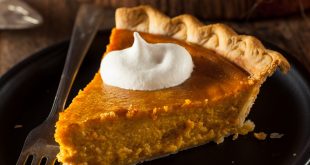 slice of pumpkin pie with whipped cream